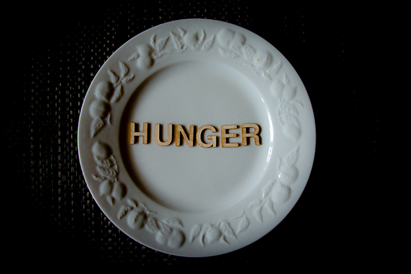 Hunger words on white plate